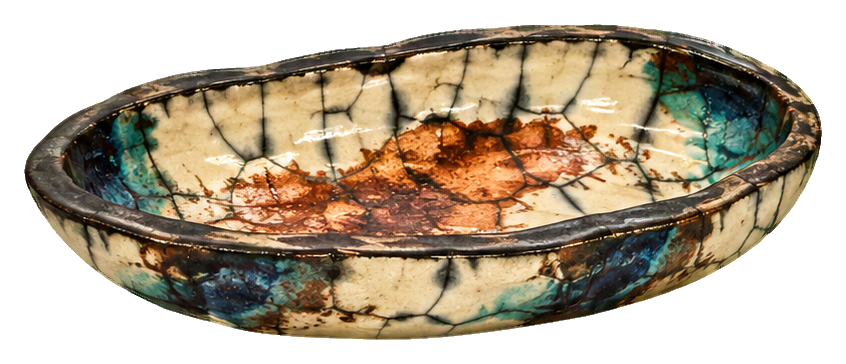 Oval raku pottery dish with blue, tan, and brown glazed ceramic pattern.