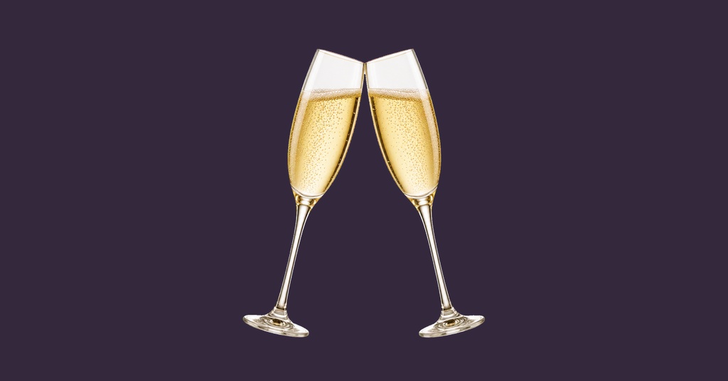 Two champagne flutes clinking on a dark purple background