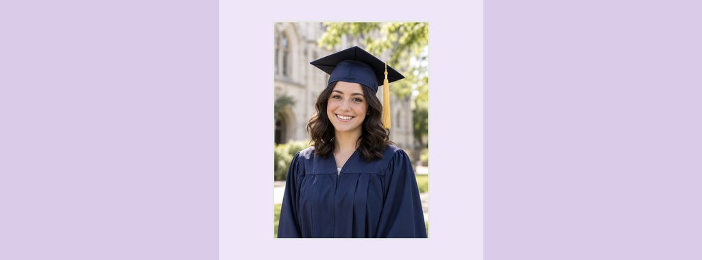 Smiling graduate in cap and gown on a light purple background