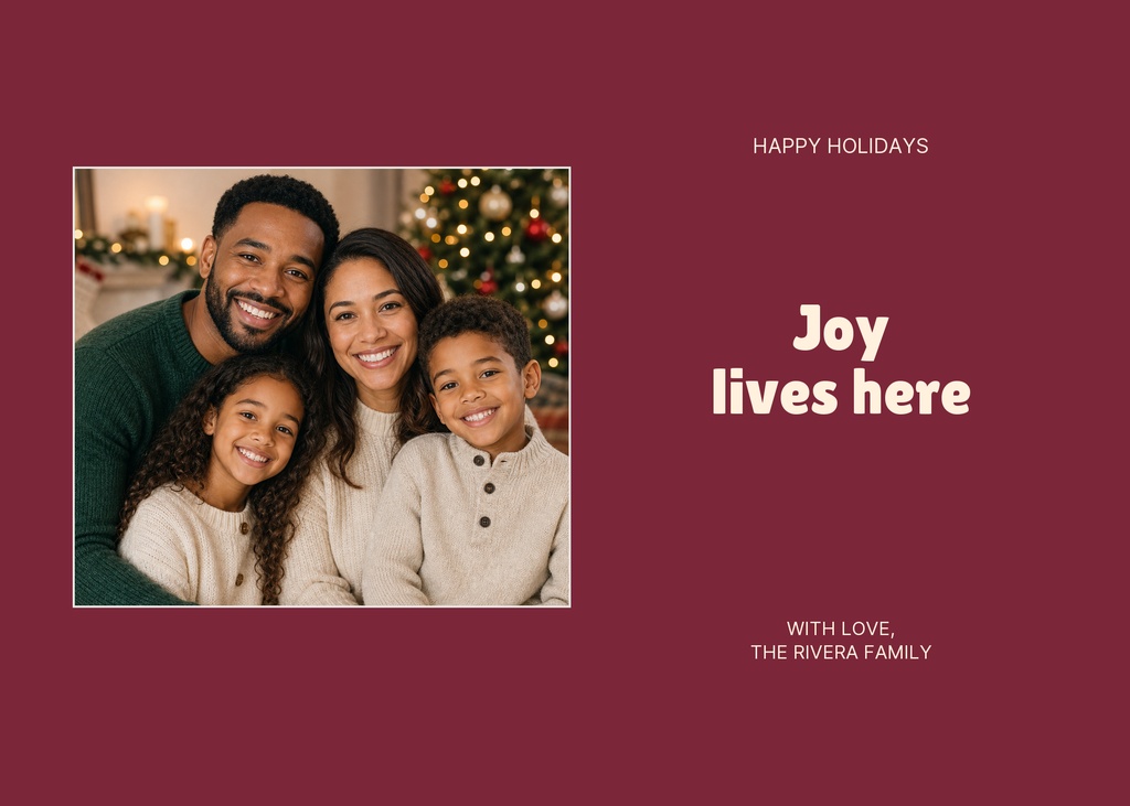 Family portrait on a maroon Christmas greeting card with the words Joy lives here.