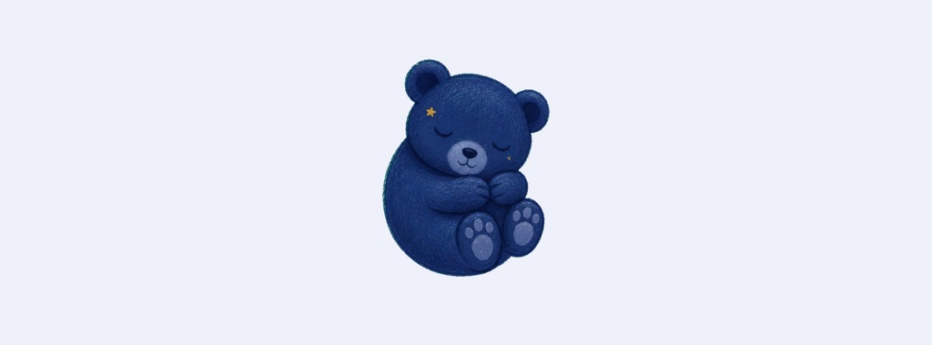 Navy teddy bear sitting on a pale background with a sleepy little dreamer look