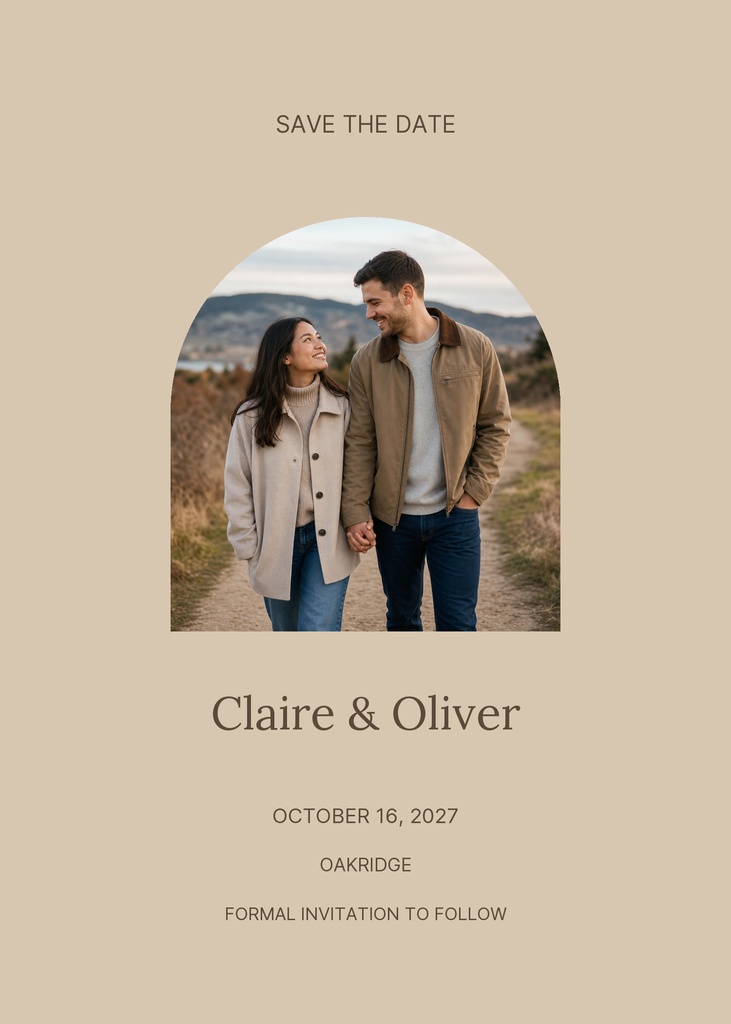 Neutral sandstone save the date card with a couple photo in an arched frame and wedding details below.