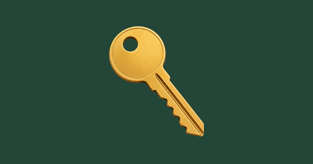 Gold key on a dark green background